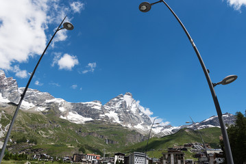 Mount Matterhorn and Cervinia city roofs, Italy.