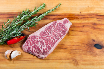 Raw beef wagyu sirloin steak on chopping board