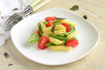 Penne pasta with green beans, cherry tomatoes and basil