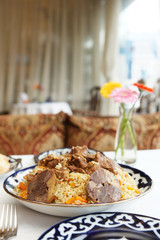 Pilaf with lamb meat, traditional Uzbek food
