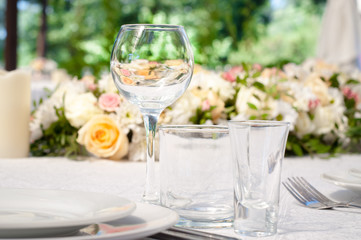 Wedding banquet tables preparing for a wedding outside on a summer day