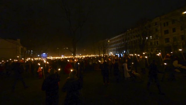 A lot of people with fire torches, Independance day celebration in Riga, Latvia