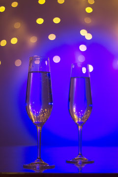 Champagne glasses in disco party bar