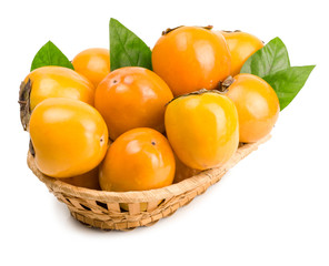 persimmons in basket on white background
