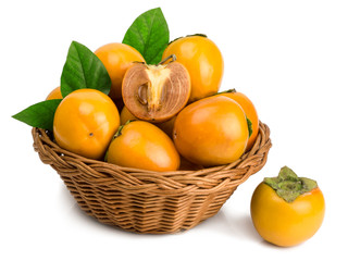 persimmons in basket on white background