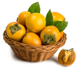 persimmons in basket on white background