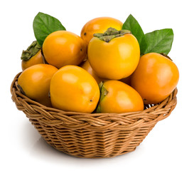 persimmons in basket on white background