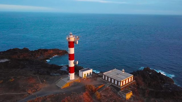 View from the height of the lighthouse Faro de Rasca on Tenerife at sunset, Canary Islands, Spain. Wild Coast of the Atlantic Ocean