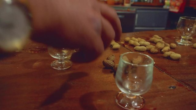 People throw peanut shell on floor in Taverna Poncha in funshal