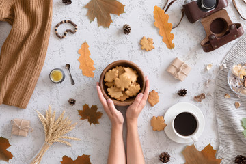 Top view of honey cookies in the shape of maple leaf on vintage autumn background, flat lay.