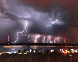 A huge amount of lightning flashing over the water. Volgograd. Russia