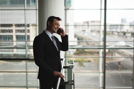 Businessman talking on the mobile phone in office