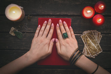 Book of magic and tarot cards on fortune teller table background. Futune reading concept....