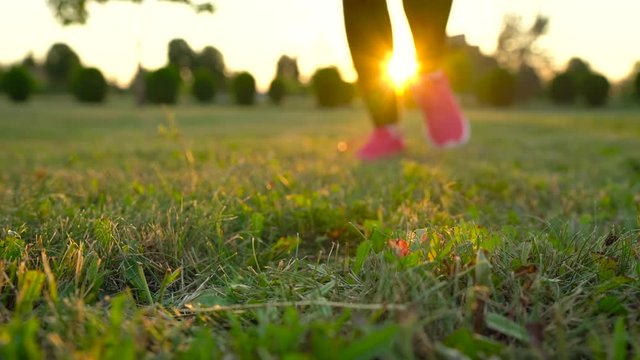 Running shoes - woman tying shoe laces. Slow motion