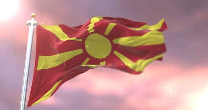 Flag of the Republic of Macedonia waving at wind in slow at sunset, loop