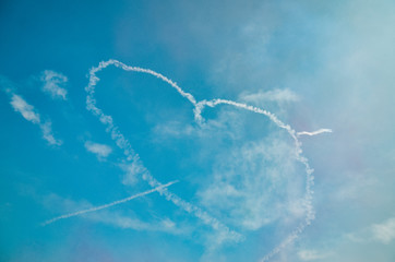 heart-shaped smoke in sky