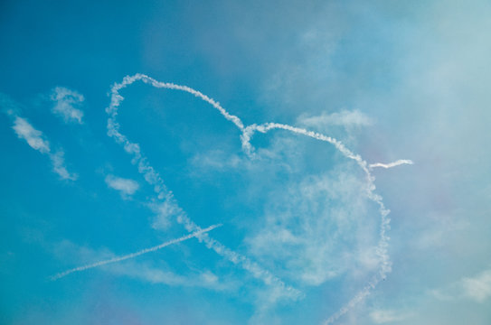 heart-shaped smoke in sky