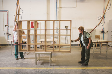 Female Workers In The Uniform Working At The Furniture Factory