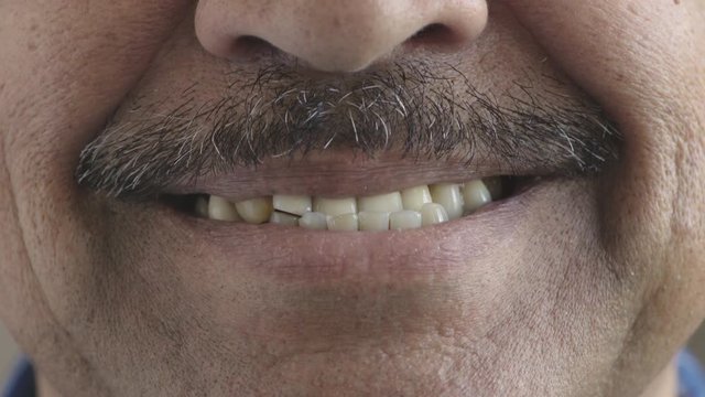 close up hispanic man mouth smiling happy teeth with moustache facial hair