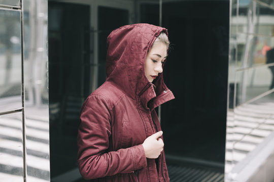 real teen girl in cherry color parka