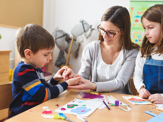 Preschool Teacher with Children at Kindergarten - Creative Art Class