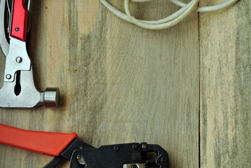 Crimping for a power wire, coil and a coil of wire on a wooden background