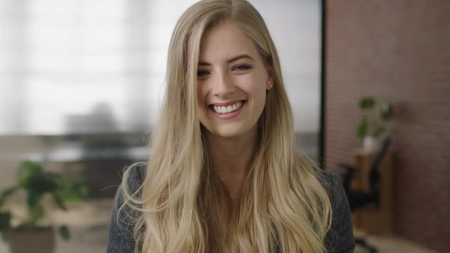 close up portrait of attractive young blonde woman executive smiling cheerful enjoying start up business opportunity
