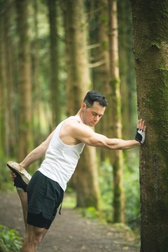 Fit Man Doing Stretching Exercise