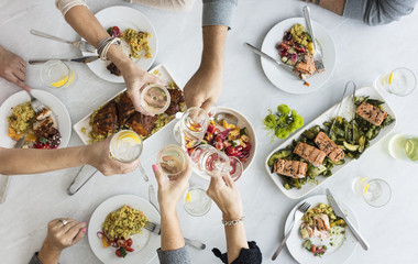 Friends in their 50's gather for lunch.