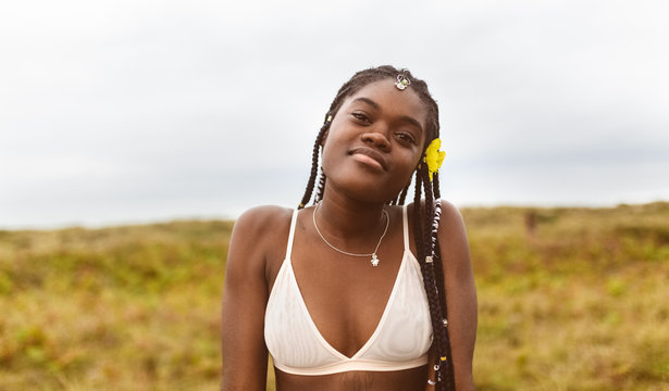 Portrait of a beautiful black woman on the beach