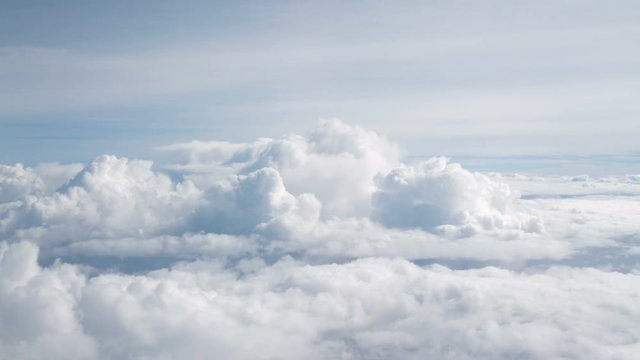 Aerial shot above the clouds in 4K