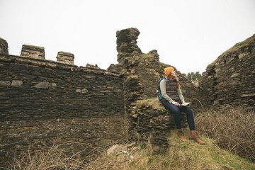 Female hiker with map looking sideways