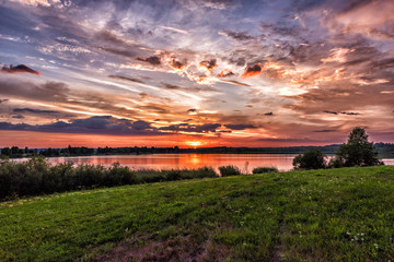 Sunset over the lake in summer