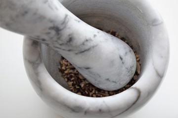 Mixture of sunflower, sesame and chia seeds in a marble morter