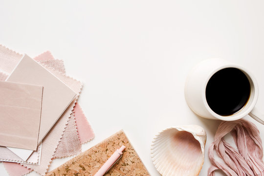 over an interior designer's desk working with blush pink