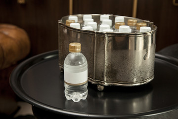 water bottle with blank label on a fancy room.