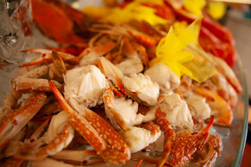 Fresh, juicy and tasty poached blue crab or horse crab chopped in their shell on ice bed. One of the sweetest, most flavorful crab on Earth.