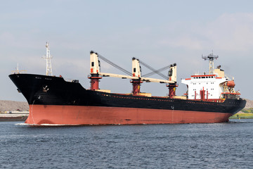 general cargo vessel shipping on canal