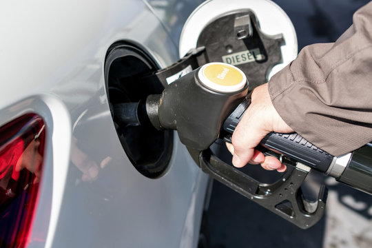 car refueling diesel pump at petrol station