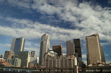 Seattle, Washington Skyline from Elliott Bay on a Beautiful Sunny Day. Modern skyscrapers line the waterfront on this rapidly growing city thanks in part due to the hi tech boom.