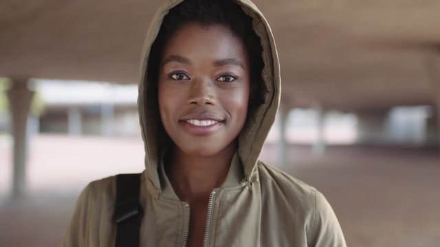 portrait of young african american woman student smiling confident wearing hoodie 