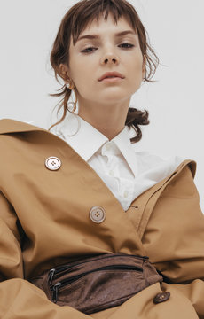Trendy female / fashion model in abstract white space.