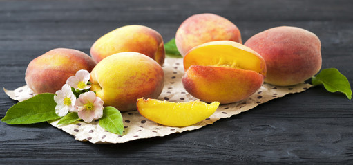 Ripe peaches on paper