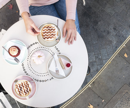 Top view of cupcakes, cakes and cappuccinos themed for Halloween season