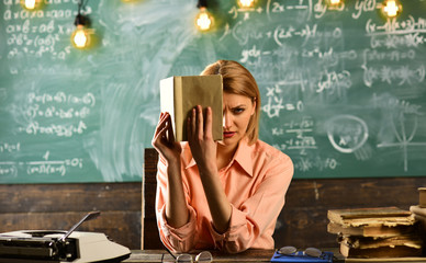 Private detective research. Information. Literature lesson with grammar book. Back to school and...