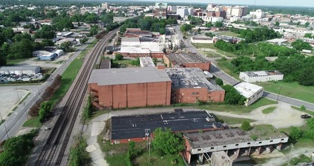 Railroad tracks adjacent to abandoned industrial section of city.