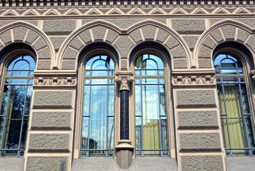 Fototapeta premium old beautiful windows on a gray stone wall
