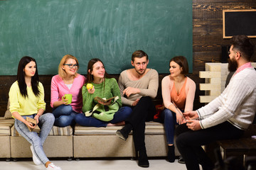 College and university concept. Group of students, group mates listening teacher, lecturer,...