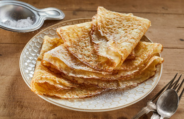 Crispy golden pancakes or griddle cakes on a plate