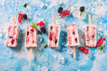 Mixed Berry Yogurt Popsicles on Chilled Surface
